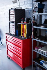A tool cabinet with various tools used for machinery maintenance